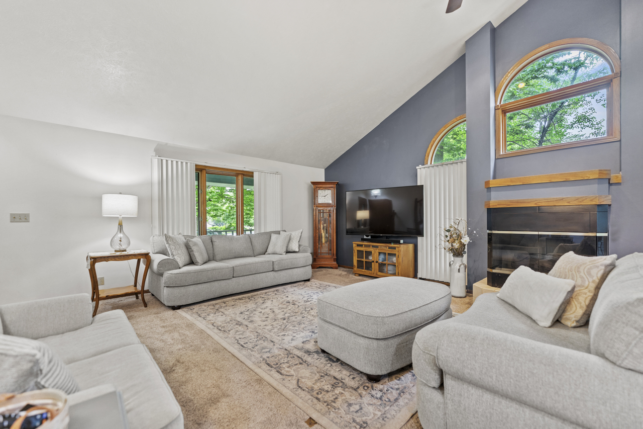 1506 Pier Drive Davis, IL 61019 - Photo 3 of 47 a living room with furniture a flat screen tv and a large window