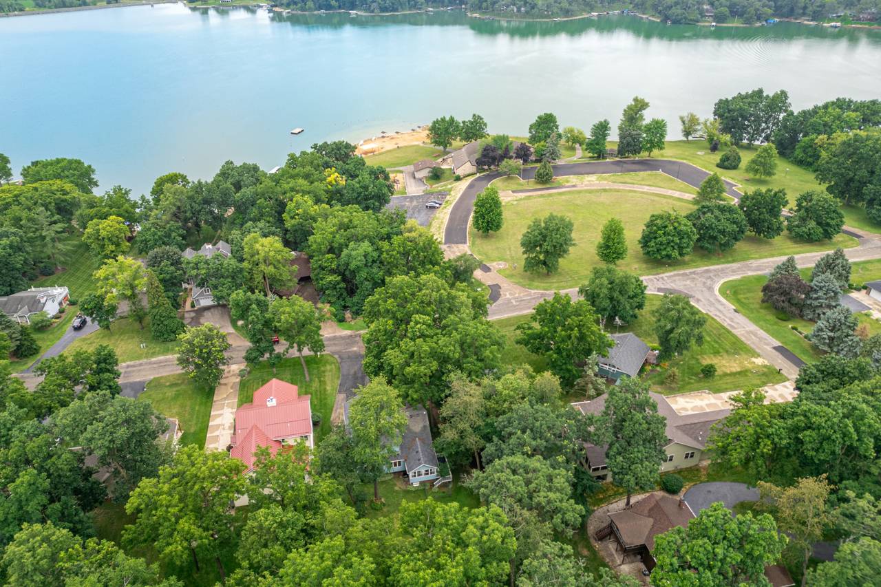 1506 Pier Drive Davis, IL 61019 - Photo 34 of 47 an aerial view of a house with a yard and lake view