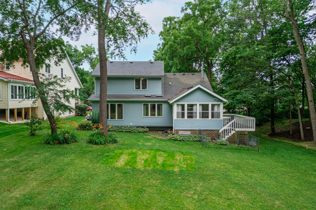 1506 Pier Drive Davis, IL 61019 - Photo 37 of 47 a front view of a house with a yard and large trees