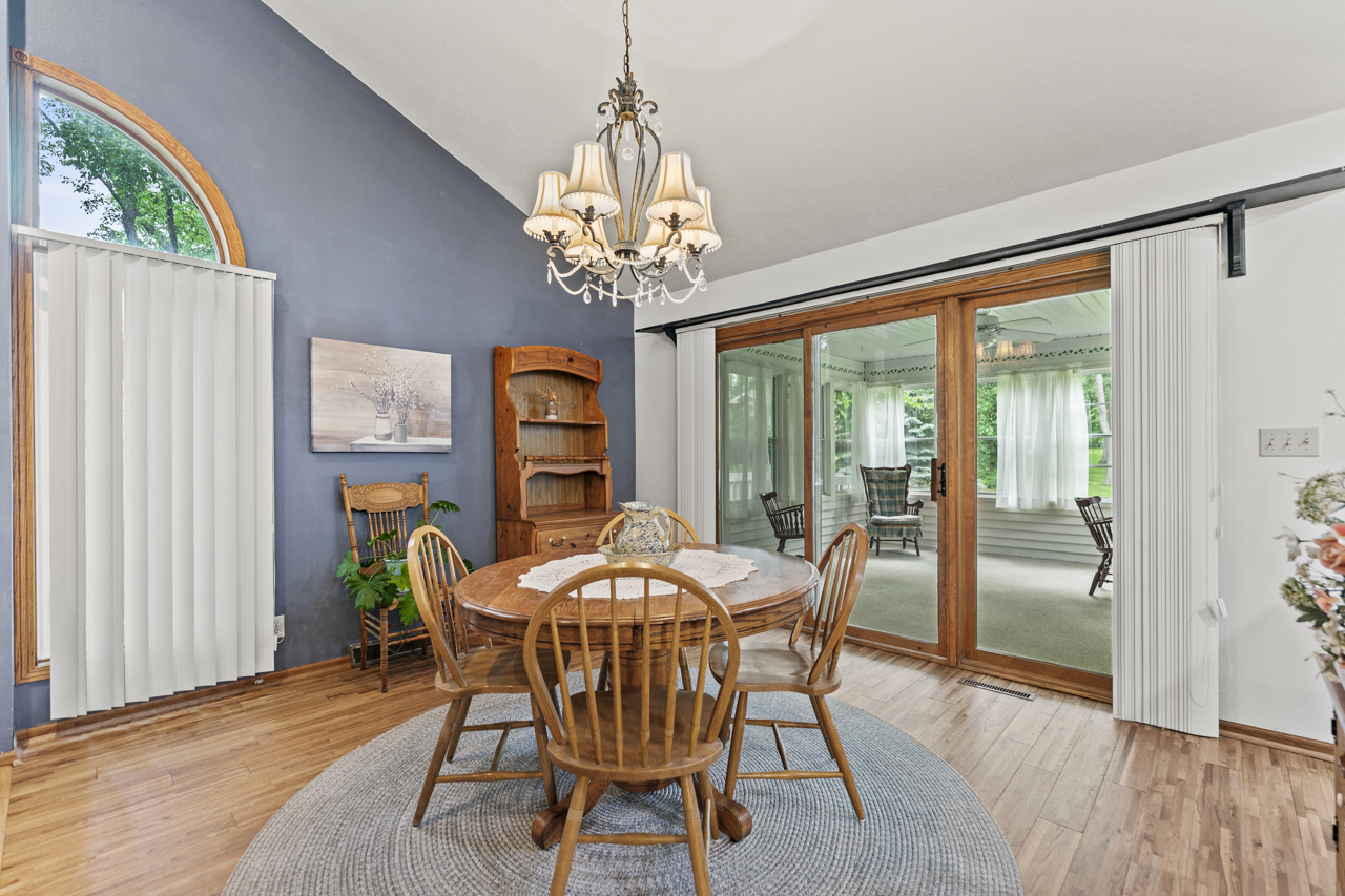 1506 Pier Drive Davis, IL 61019 - Photo 6 of 47 a dining room with furniture a chandelier and wooden floor