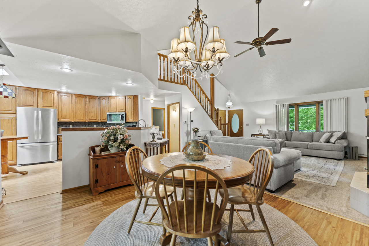 1506 Pier Drive Davis, IL 61019 - Photo 7 of 47 a view of a dining room with furniture a kitchen and chandelier