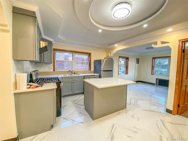 a kitchen with stove and cabinets