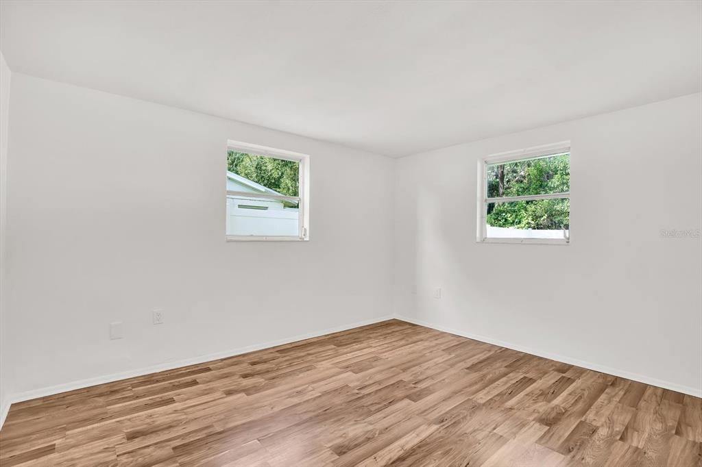 6701 Parkside Drive New Port Richey, FL 34653 - Photo 12 of 26 a view of room with window and hardwood floor