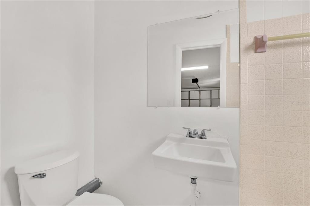 6701 Parkside Drive New Port Richey, FL 34653 - Photo 14 of 26 a bathroom with a sink mirror and toilet