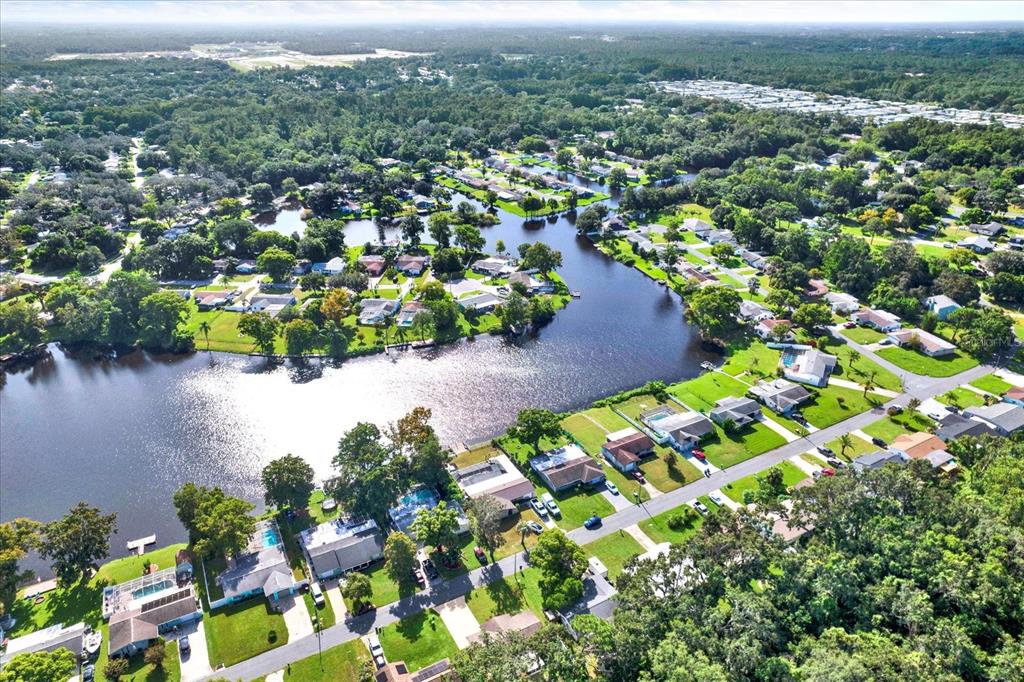 6701 Parkside Drive New Port Richey, FL 34653 - Photo 24 of 26 an aerial view of residential houses with outdoor space and swimming pool