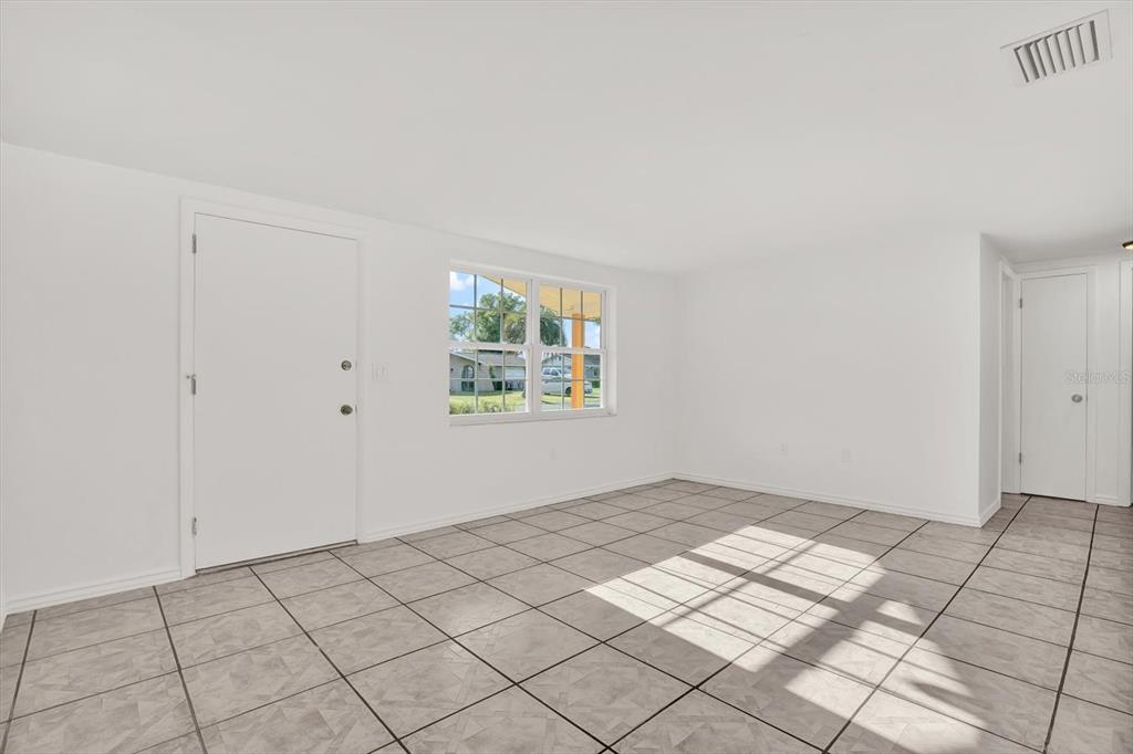 6701 Parkside Drive New Port Richey, FL 34653 - Photo 3 of 26 a view of an empty room and window
