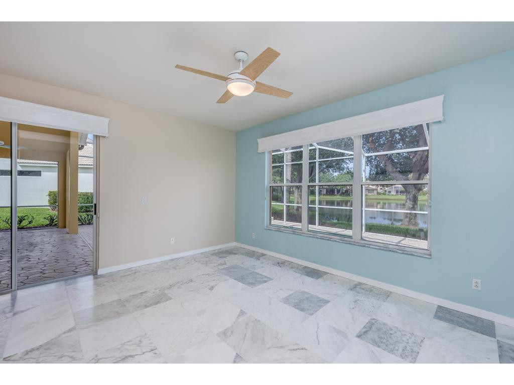 2011 Timarron Way Naples, FL 34109 - Photo 11 of 18 a view of an empty room with a window