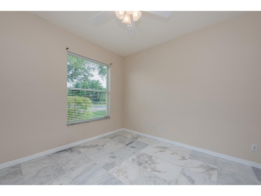 2011 Timarron Way Naples, FL 34109 - Photo 13 of 18 a view of an empty room with a window
