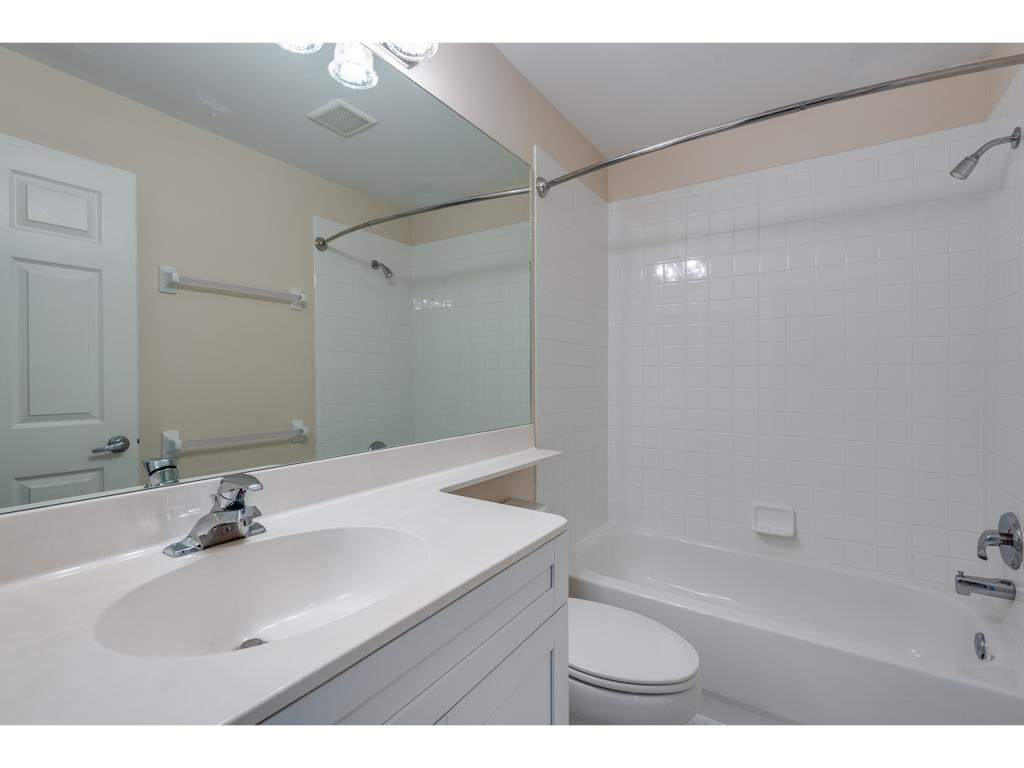 2011 Timarron Way Naples, FL 34109 - Photo 14 of 18 a bathroom with a sink mirror toilet and bathtub