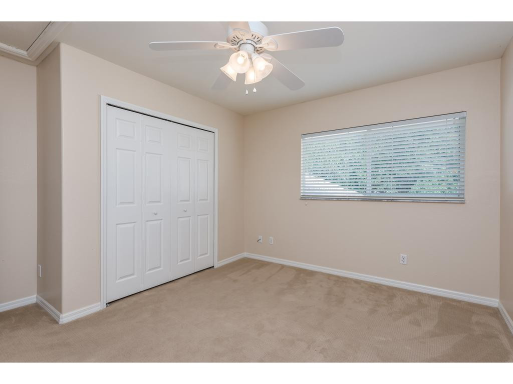 2011 Timarron Way Naples, FL 34109 - Photo 15 of 18 a view of an empty room with a window