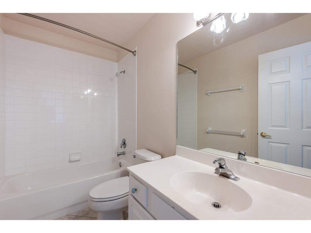 2011 Timarron Way Naples, FL 34109 - Photo 16 of 18 a bathroom with a sink a toilet and shower
