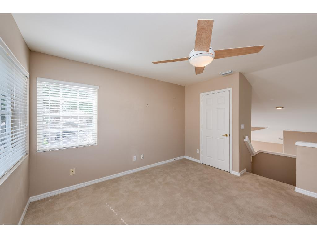 2011 Timarron Way Naples, FL 34109 - Photo 17 of 18 a view of an empty room with a window