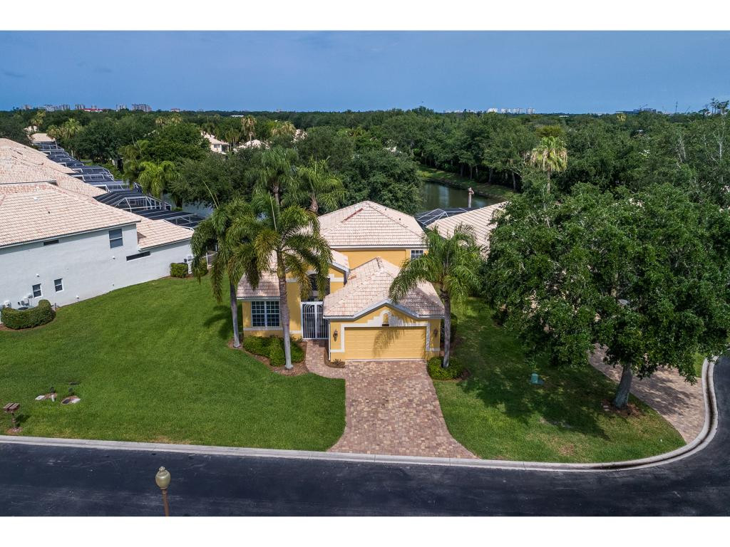 2011 Timarron Way Naples, FL 34109 - Photo 4 of 18 a view of a yard with front of house