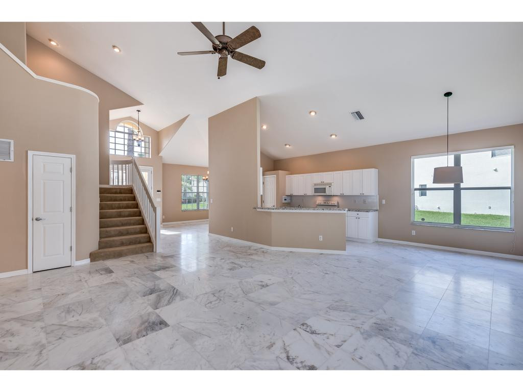 2011 Timarron Way Naples, FL 34109 - Photo 5 of 18 a view of a kitchen with a sink and a window