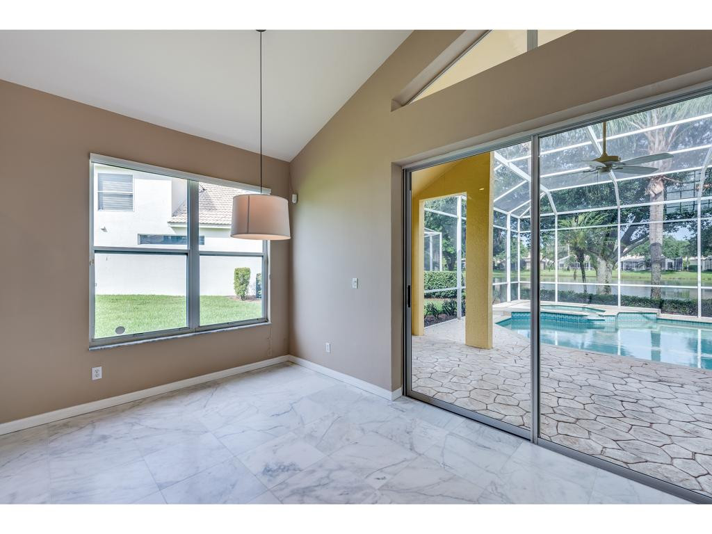 2011 Timarron Way Naples, FL 34109 - Photo 9 of 18 a view of empty room with windows
