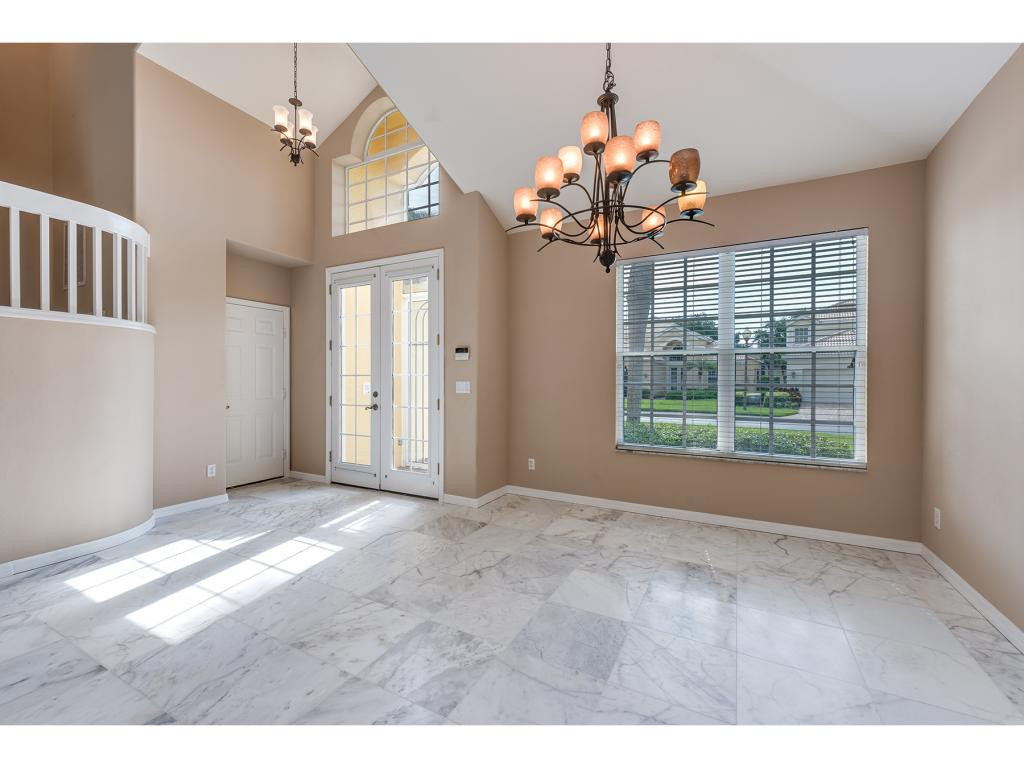 2011 Timarron Way Naples, FL 34109 - Photo 10 of 18 a view of an empty room with a window
