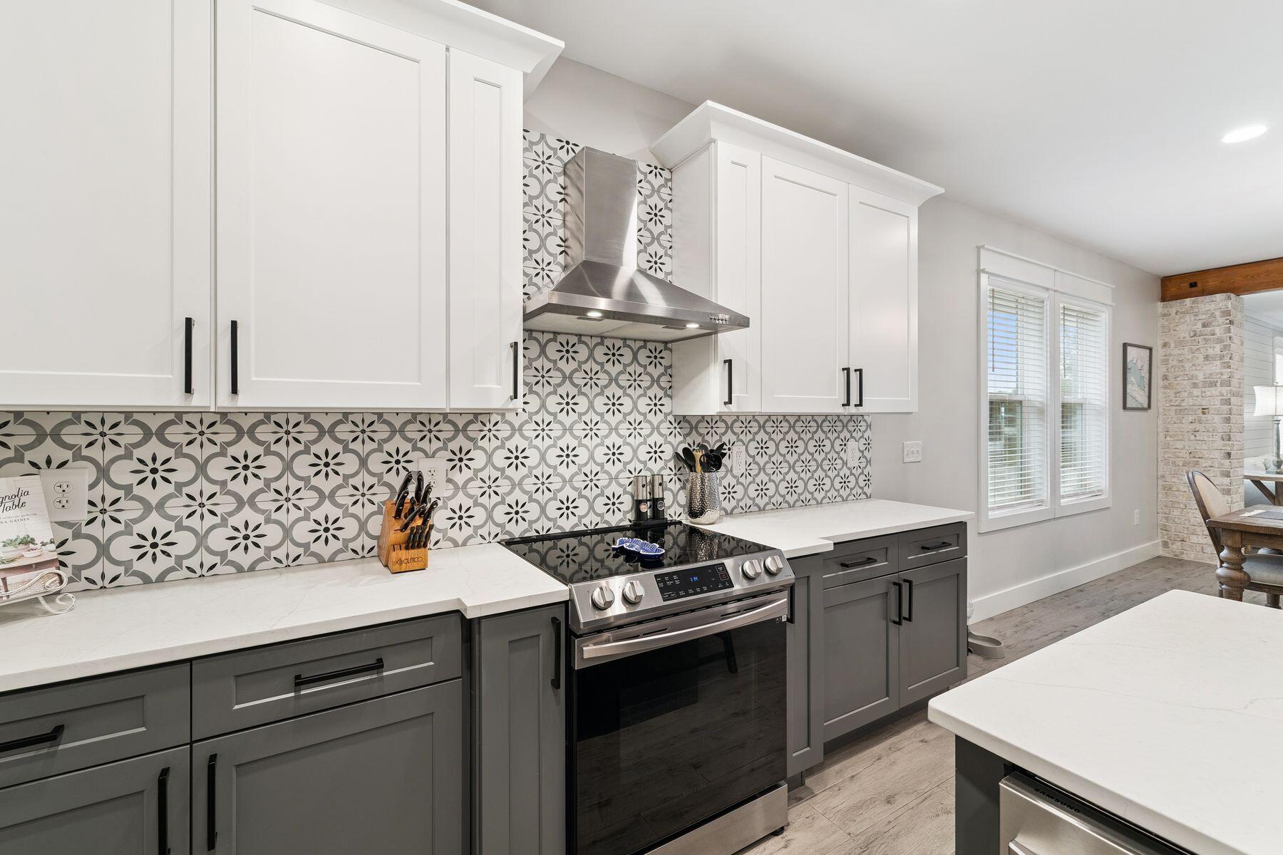 934 Bay Grove Road Freeport, FL 32439 - Photo 12 of 37 a kitchen with a sink stove and cabinets