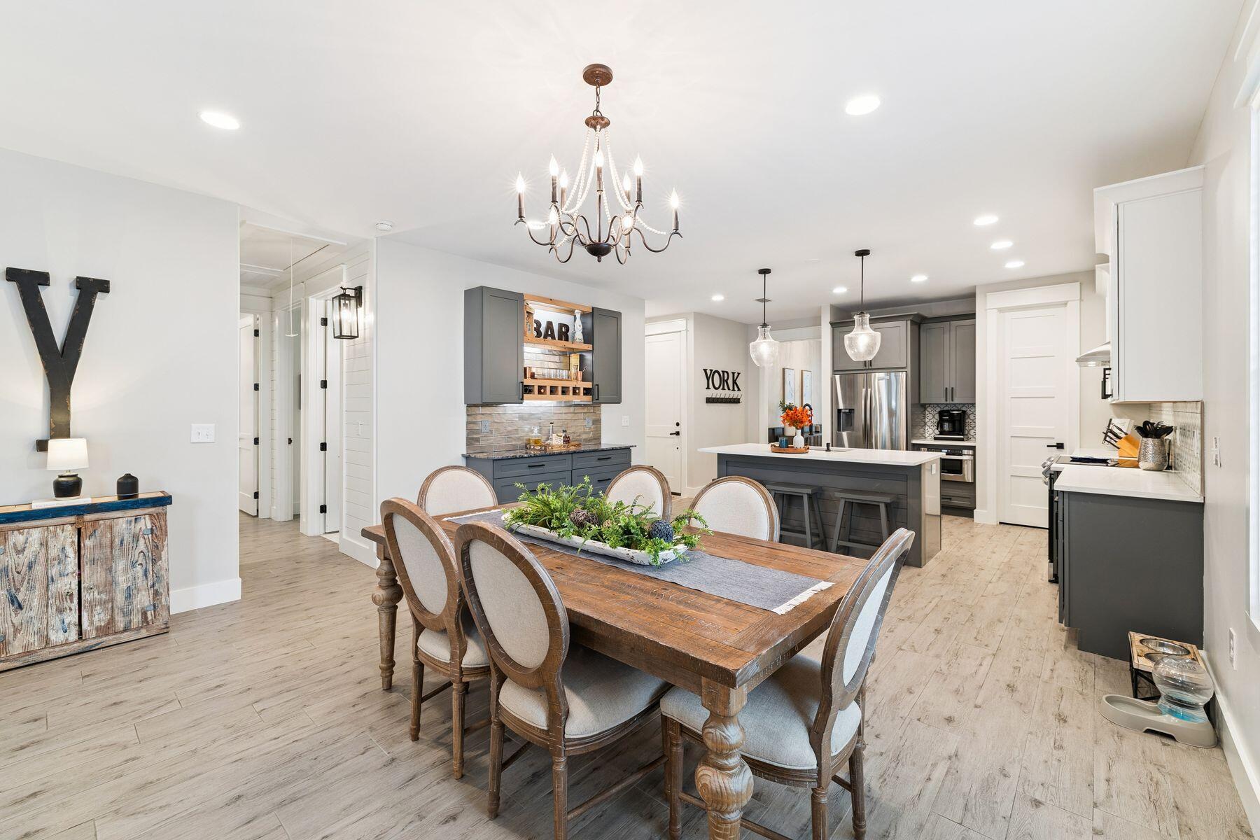 934 Bay Grove Road Freeport, FL 32439 - Photo 13 of 37 a view of a dining room with furniture and wooden floor