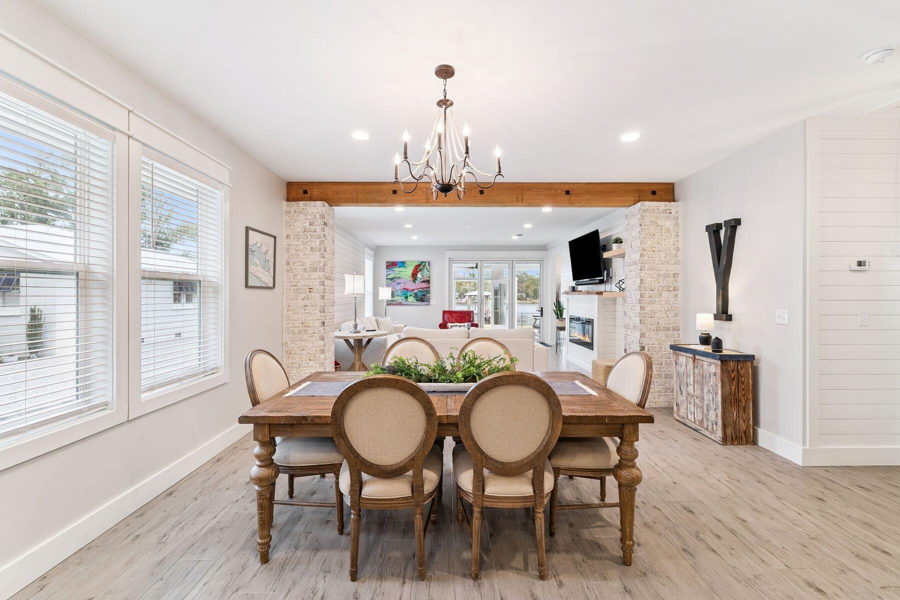 934 Bay Grove Road Freeport, FL 32439 - Photo 14 of 37 a view of a dining room with furniture window and wooden floor