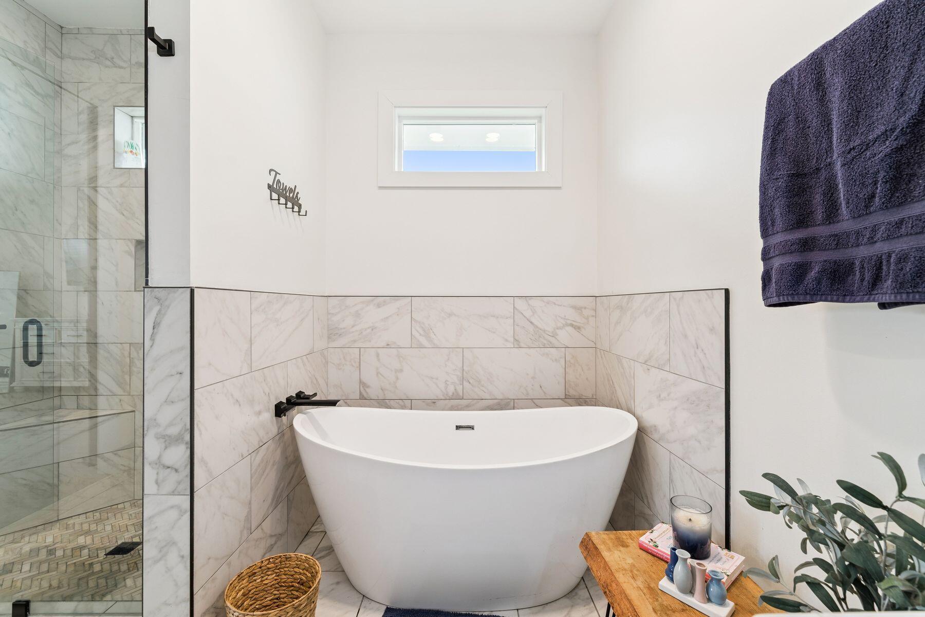 934 Bay Grove Road Freeport, FL 32439 - Photo 22 of 37 a white bath tub sitting in a bathroom