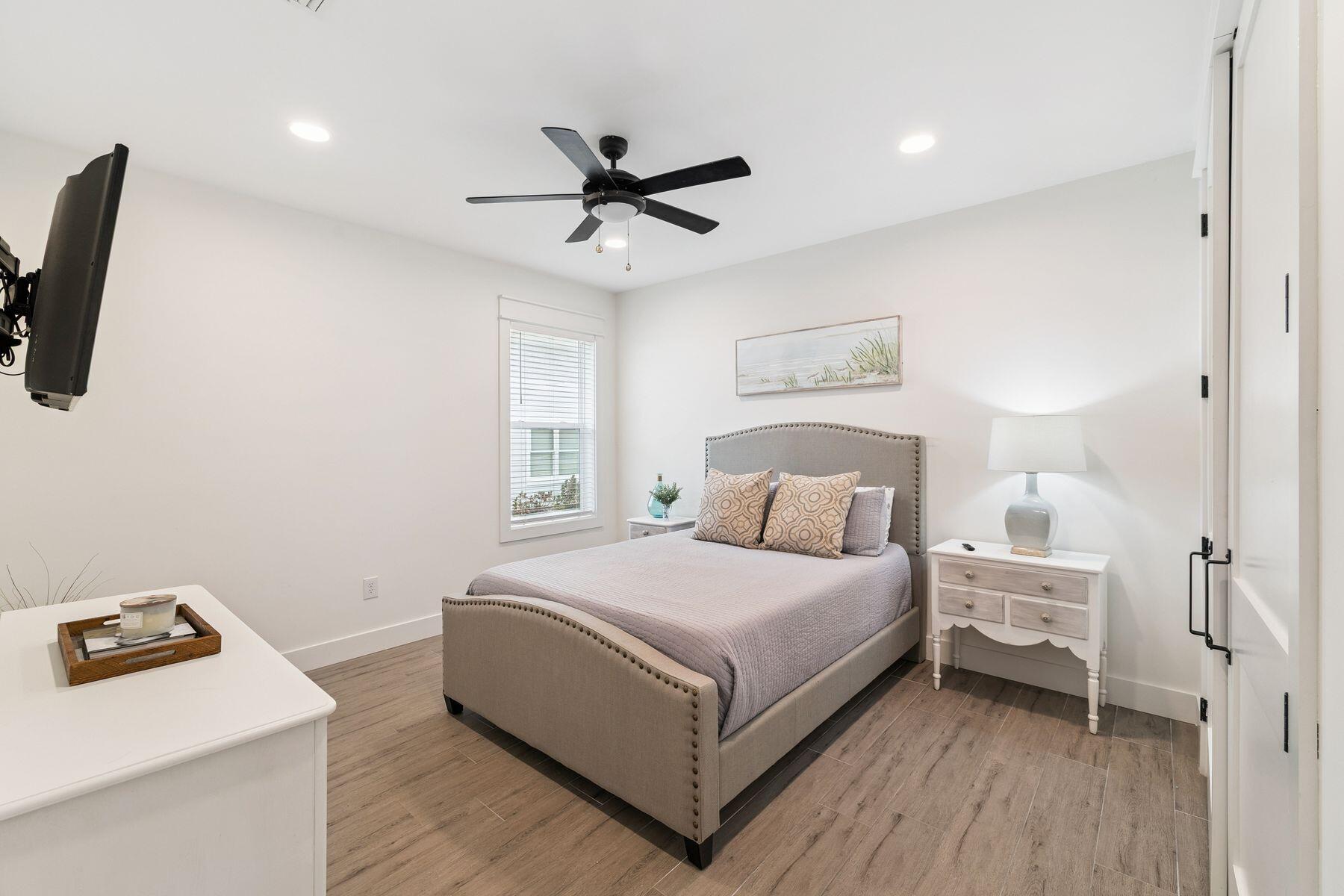 934 Bay Grove Road Freeport, FL 32439 - Photo 23 of 37 a bedroom with a bed and a tv