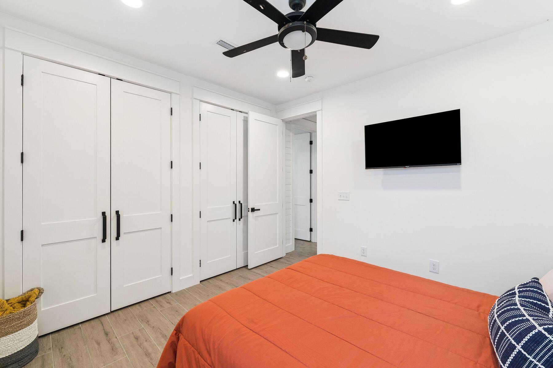 934 Bay Grove Road Freeport, FL 32439 - Photo 26 of 37 a bedroom with a bed and a flat screen tv