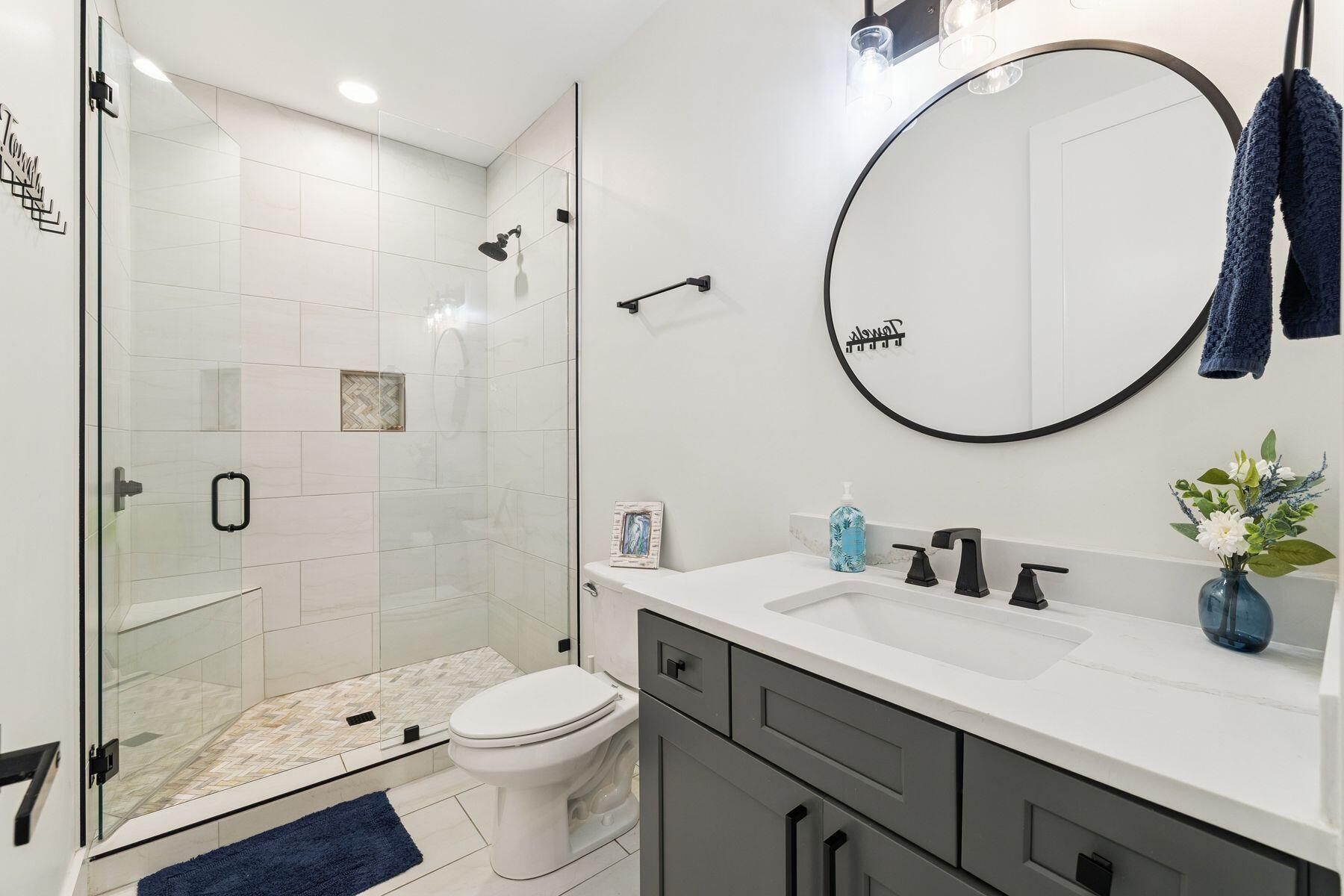 934 Bay Grove Road Freeport, FL 32439 - Photo 27 of 37 a bathroom with a sink a toilet and a mirror