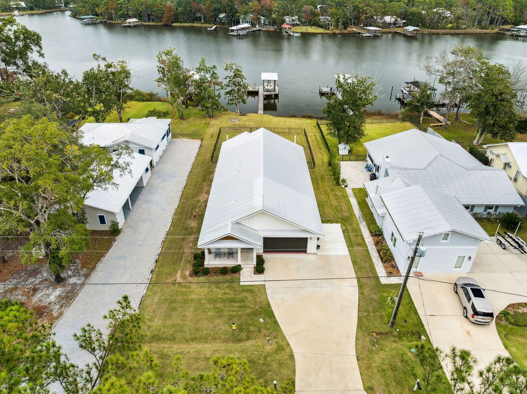 934 Bay Grove Road Freeport, FL 32439 - Photo 4 of 37 an aerial view of a house with swimming pool and outdoor space