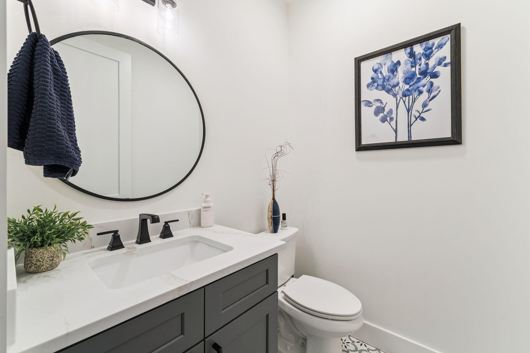 934 Bay Grove Road Freeport, FL 32439 - Photo 8 of 37 a bathroom with a sink mirror and toilet