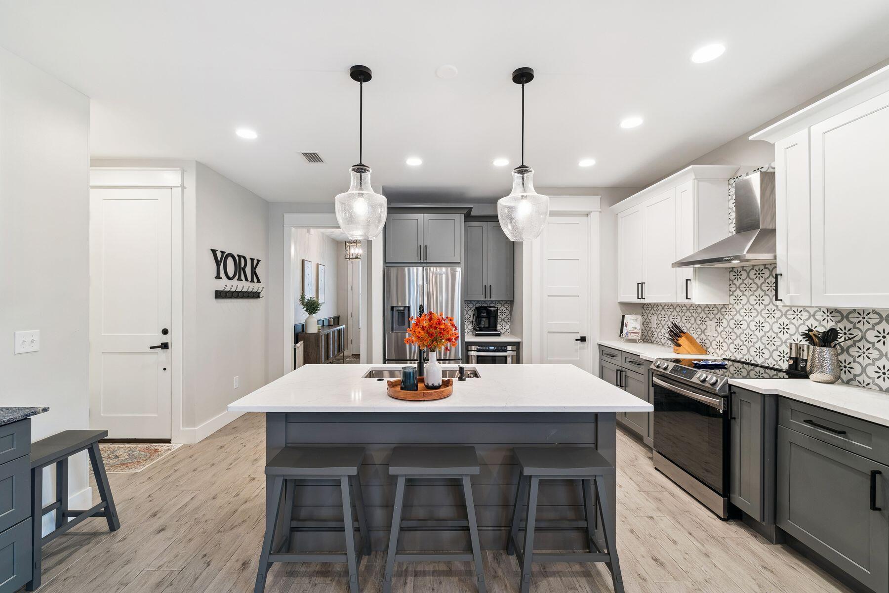 934 Bay Grove Road Freeport, FL 32439 - Photo 9 of 37 a kitchen with a dining table chairs sink and cabinets