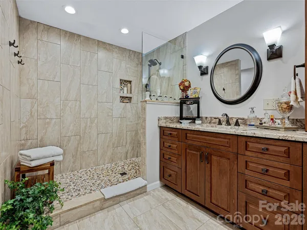 a bathroom with 2 sink and a mirror