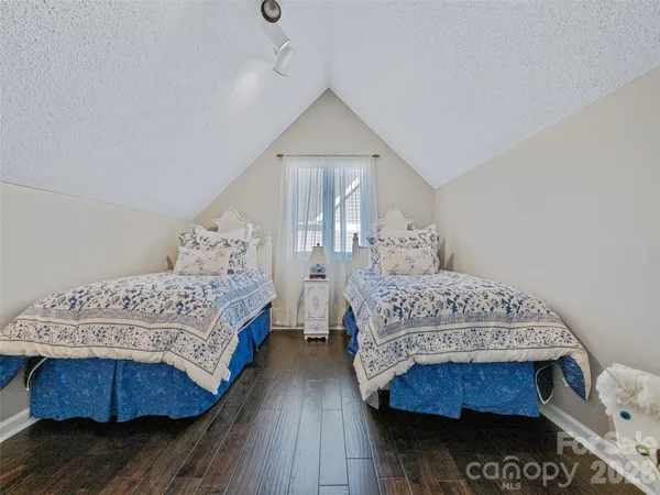 a bathroom with a sink vanity mirror and toilet