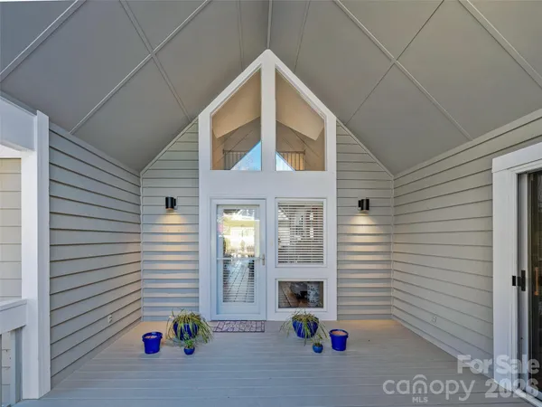 a view of an outdoor space kitchen and a window
