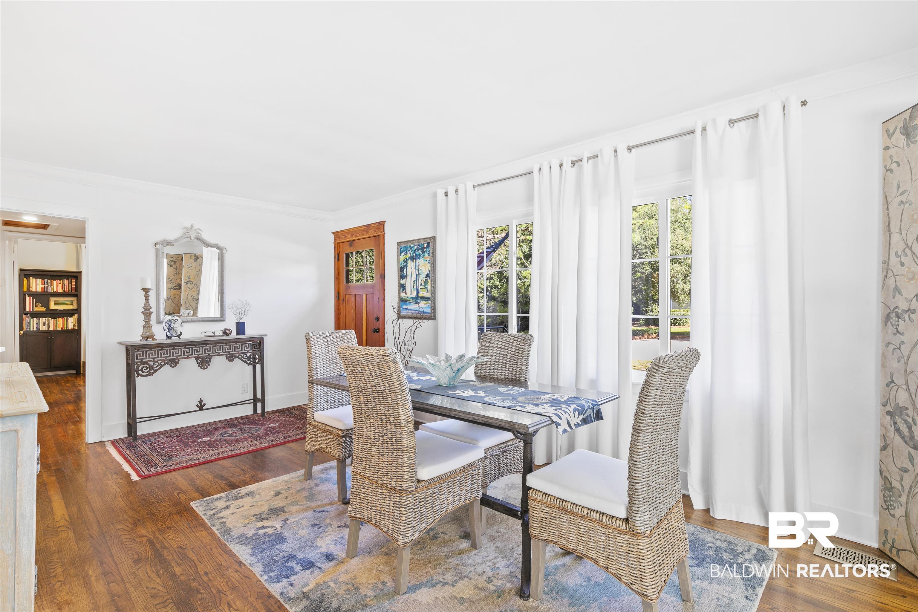 220 Pinecrest Lane Fairhope, AL 36532 - Photo 7 of 32 Dining space featuring ornamental molding and dark hardwood / wood-style floors