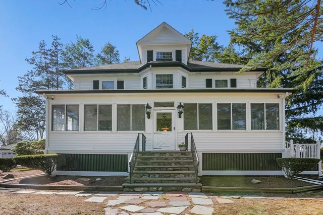 a hallway with furniture and wooden floor