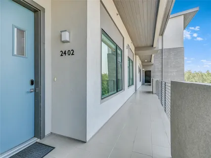 a view of a hallway with windows