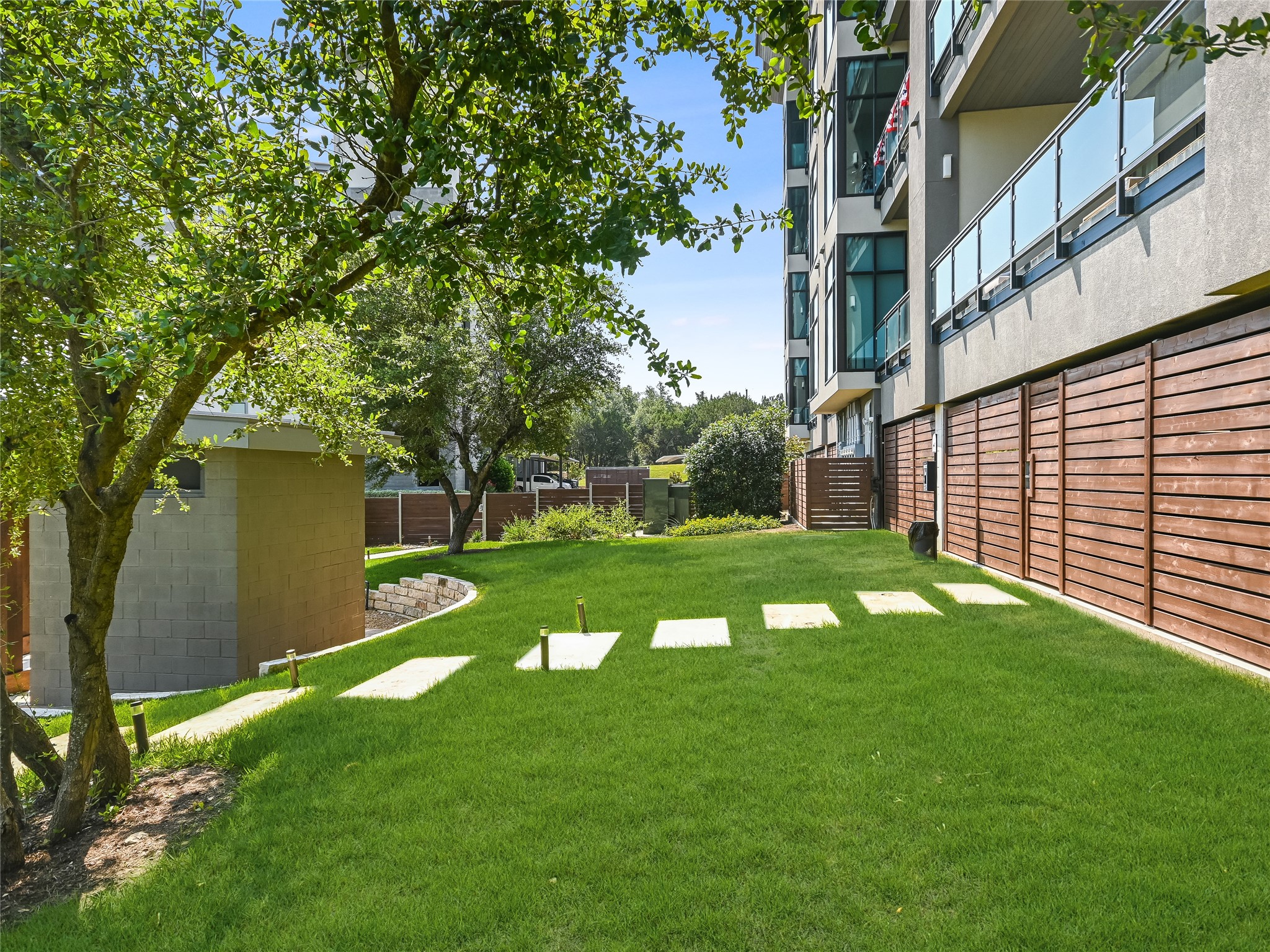 5921 Hiline Road, Unit 2402 Austin, TX 78734 - Photo 21 of 31 a view of a house with a yard