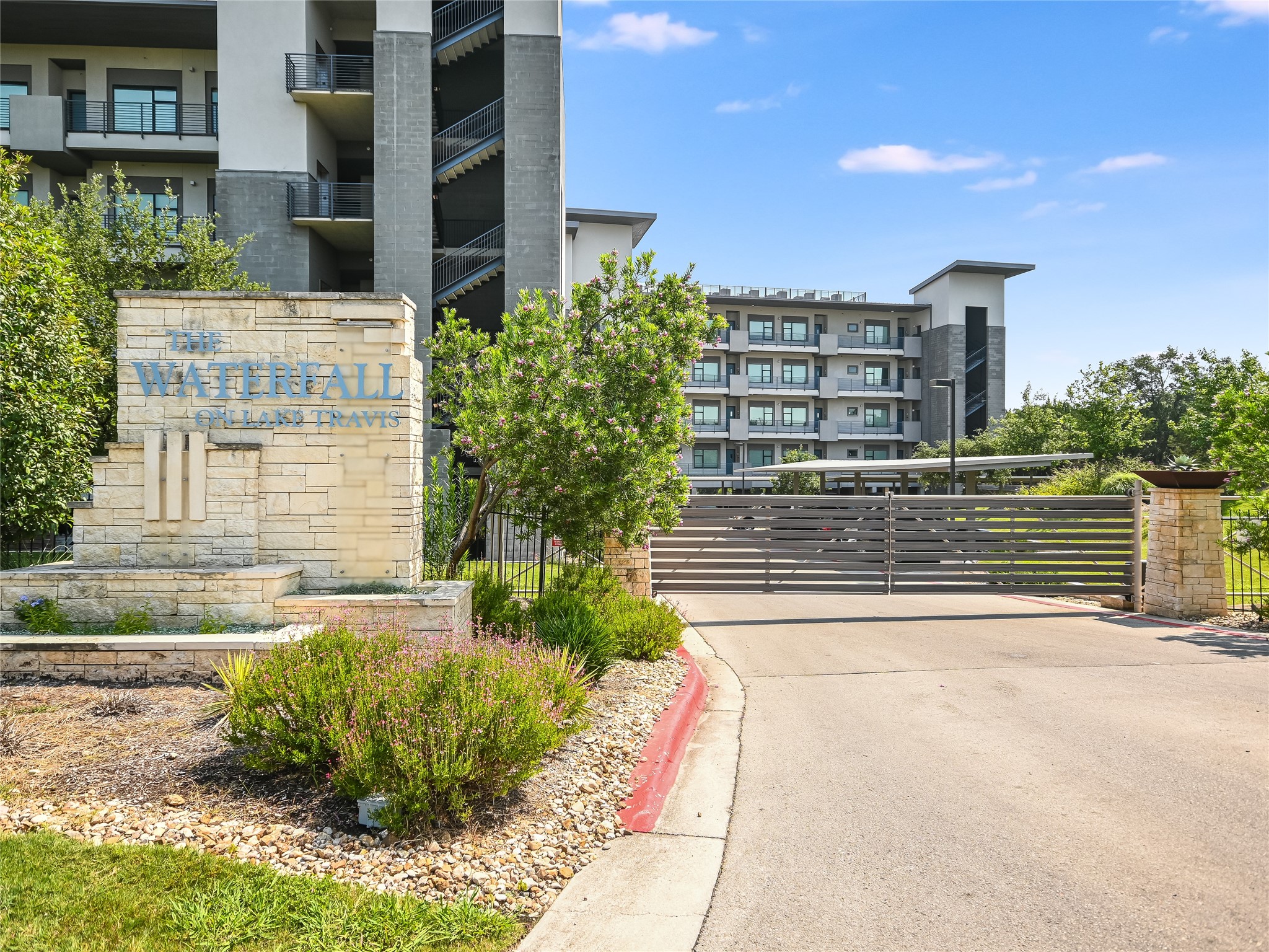 5921 Hiline Road, Unit 2402 Austin, TX 78734 - Photo 22 of 31 a front view of a house with a yard