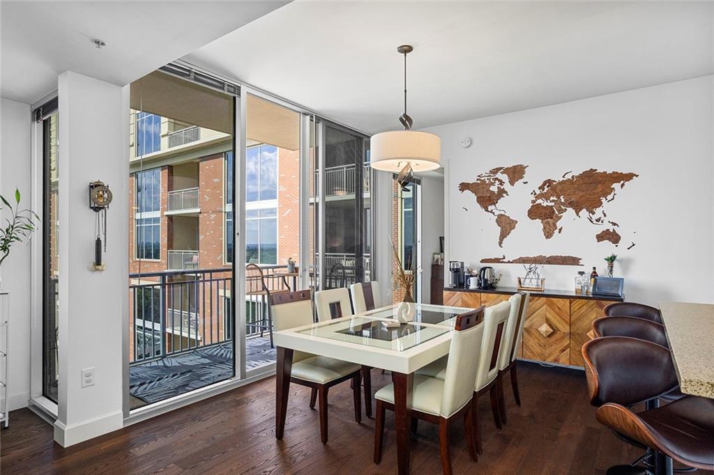 1820 Peachtree Road Northwest, Unit 1509 Atlanta, GA 30309 - Photo 30 of 61 a view of a dining room with furniture window and wooden floor