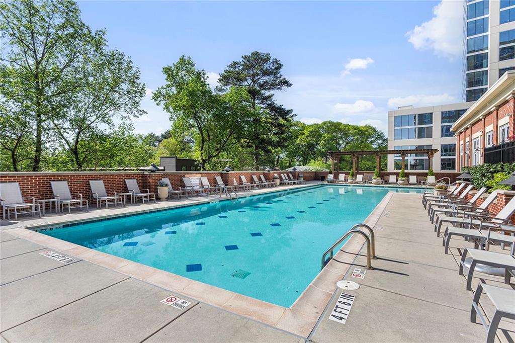 1820 Peachtree Road Northwest, Unit 1509 Atlanta, GA 30309 - Photo 47 of 61 a view of a swimming pool with a patio