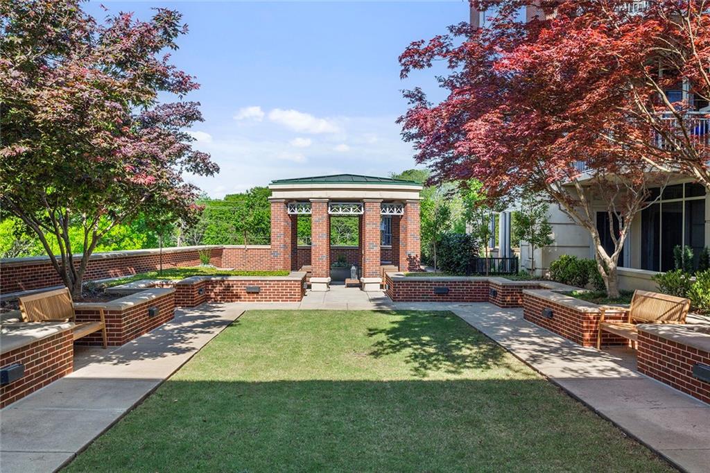 1820 Peachtree Road Northwest, Unit 1509 Atlanta, GA 30309 - Photo 53 of 61 a view of a house with backyard sitting area and garden