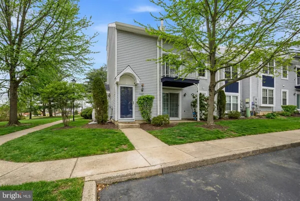 a view of a yard in front of a house