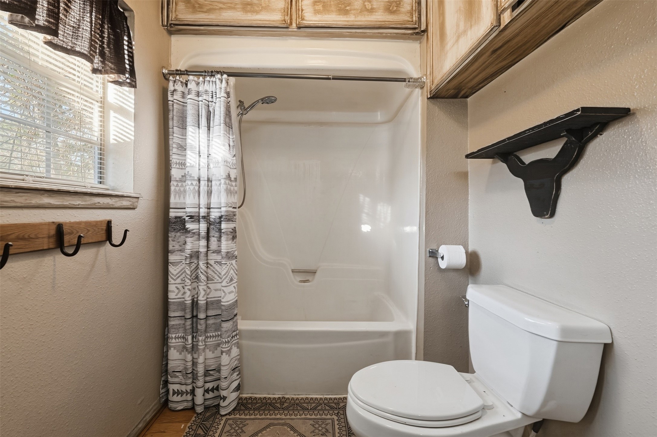 4027 Spring Branch Road Montgomery, TX 77316 - Photo 19 of 32 a bathroom with a toilet and a shower