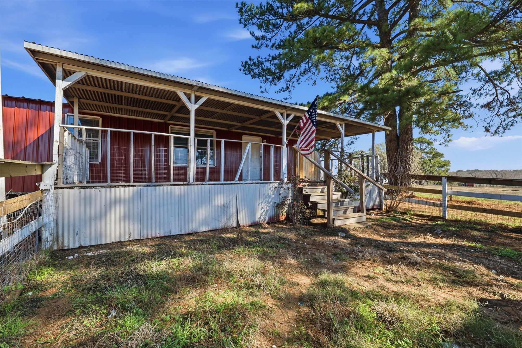 4027 Spring Branch Road Montgomery, TX 77316 - Photo 29 of 32 a view of a house with a small yard and wooden fence
