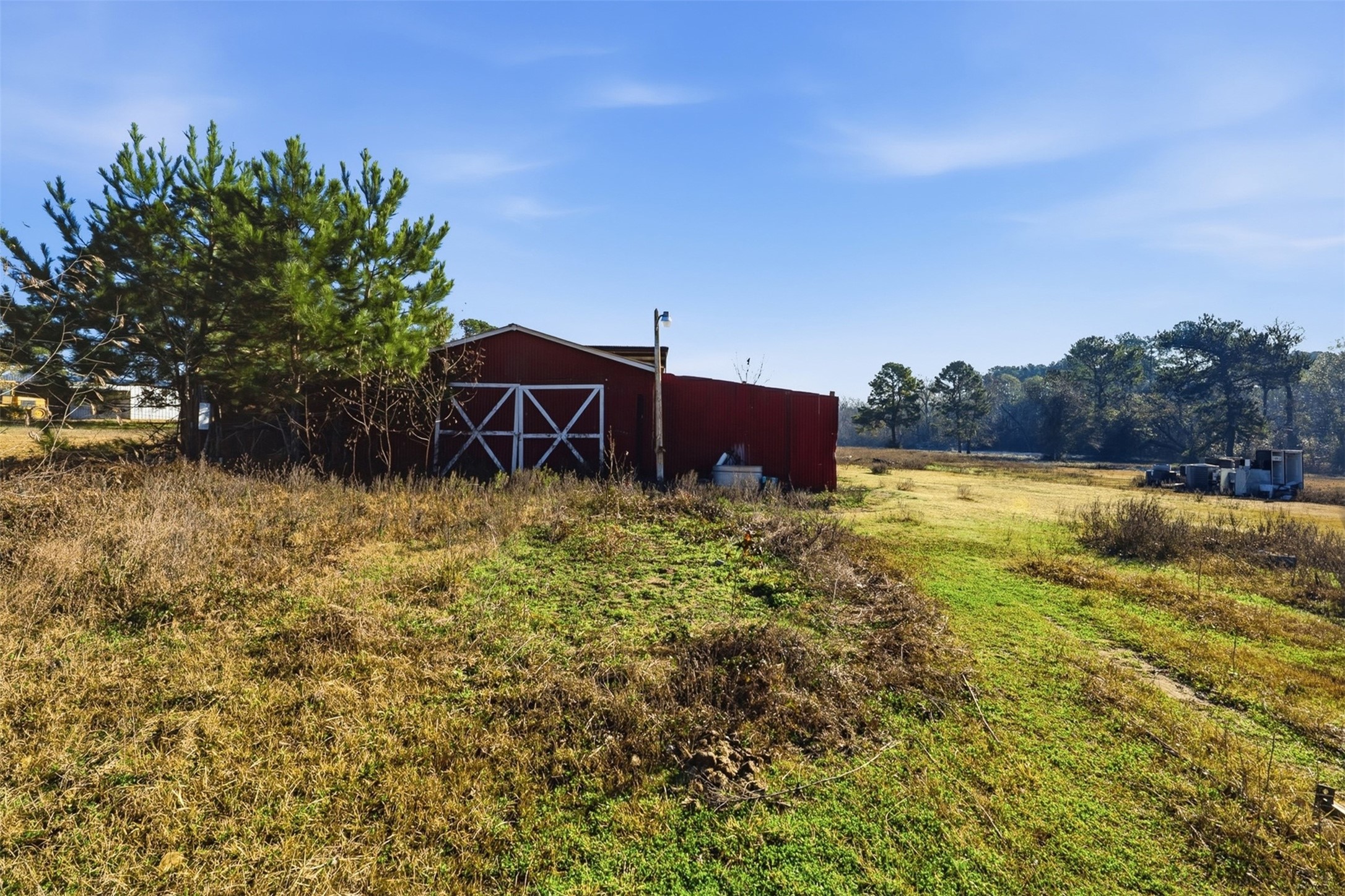 4027 Spring Branch Road Montgomery, TX 77316 - Photo 8 of 32 a view of a garden with plants and a bench