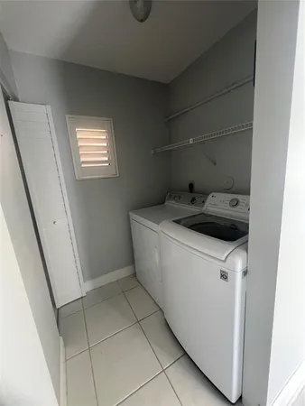 a front view of a house with a garden and a yard