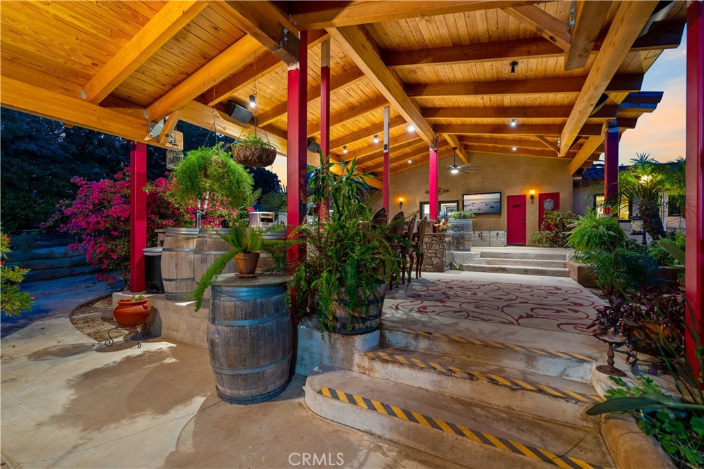 40430 Parado Del Sol Drive Temecula, CA 92592 - Photo 16 of 75 a view of a patio with table and chairs potted plants