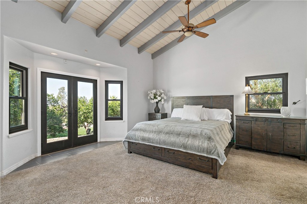 40430 Parado Del Sol Drive Temecula, CA 92592 - Photo 30 of 75 a spacious bedroom with a large bed and a window