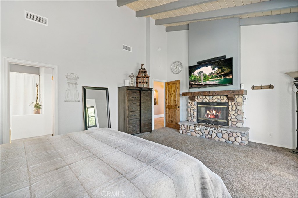 40430 Parado Del Sol Drive Temecula, CA 92592 - Photo 32 of 75 a bedroom with a bed and a flat screen tv