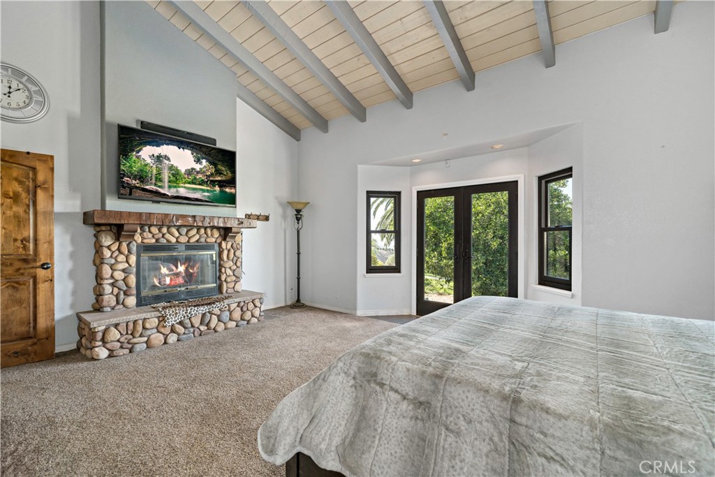 40430 Parado Del Sol Drive Temecula, CA 92592 - Photo 33 of 75 a view of an empty room with a fireplace and a window